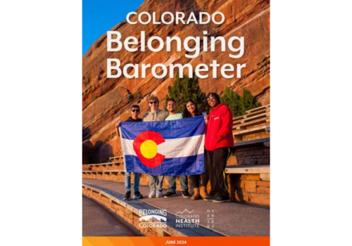 Report cover photo with 5 diverse people standing together holding the Colorado state flag in front of a red rock formation